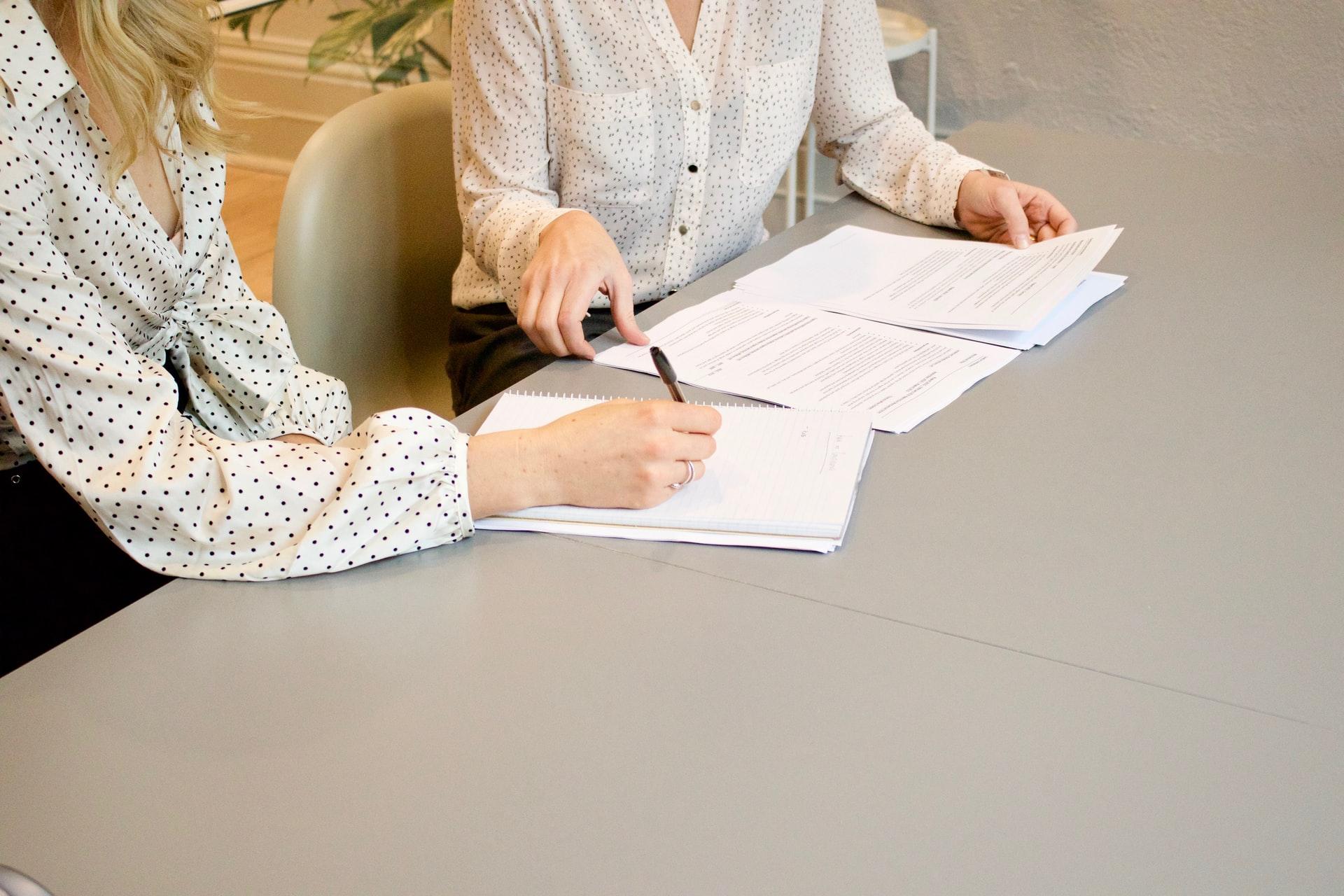 women signing a contract